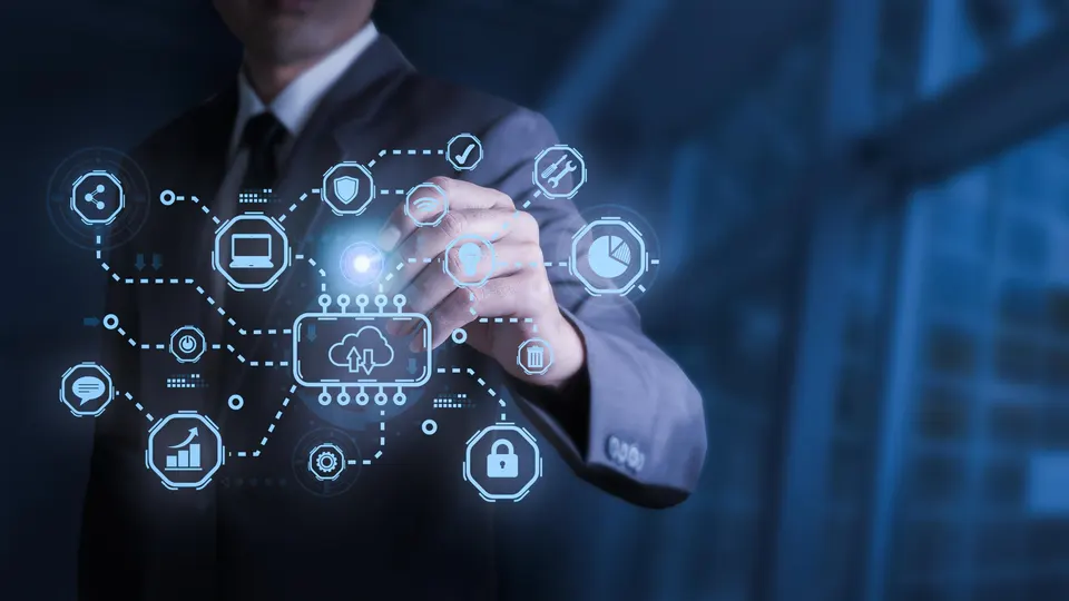 A business leader touching a network of connected digital icons representing cloud, security, analytics and collaboration.